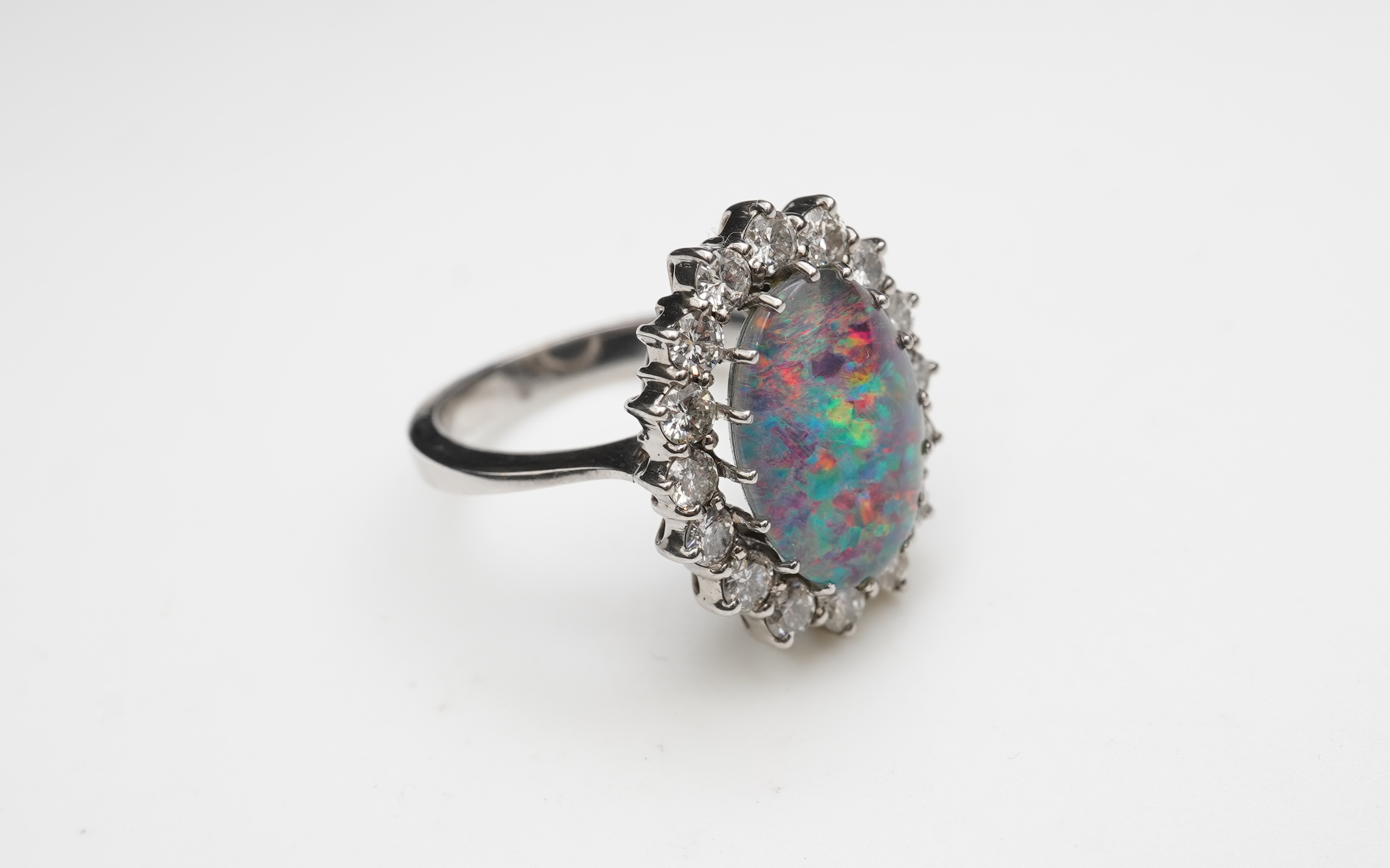 An opal triplet and diamond ring